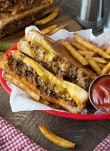 Delicious Sloppy Joe Grilled Cheese sandwich with melted cheese and savory sloppy joe filling.