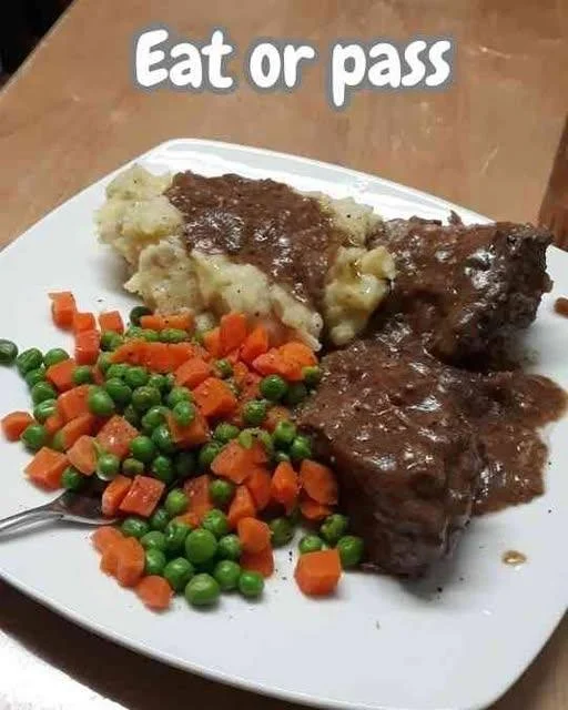 Delicious slow-cooked pot roast with gravy on creamy mashed potatoes