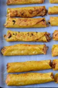 Delicious slow cooker chicken taquitos ready to serve.