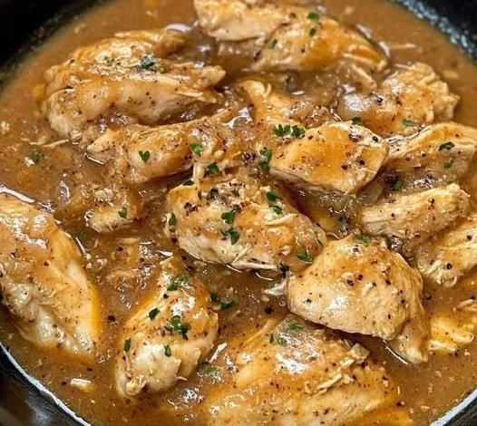 Delicious slow cooker chicken served with rich gravy