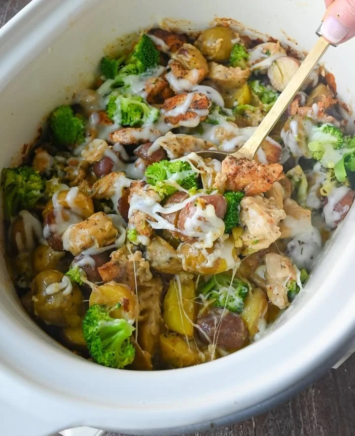 Slow Cooker Garlic Parmesan Chicken with potatoes cooking in a crockpot