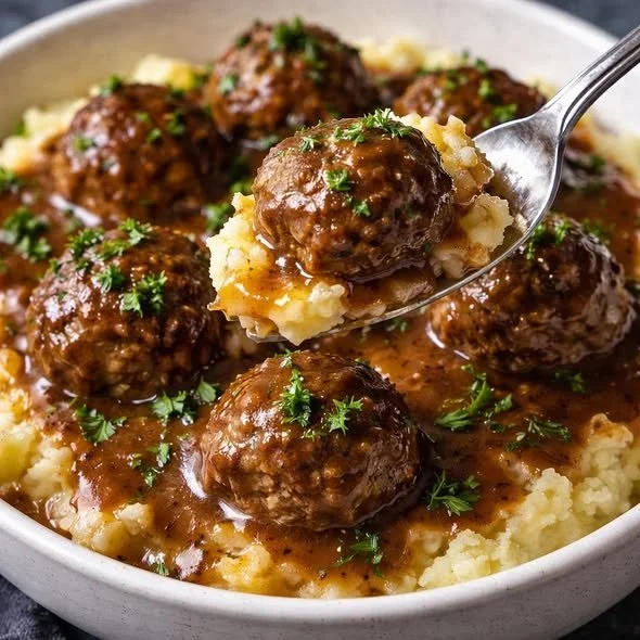 Delicious slow cooker Salisbury steak meatballs served with gravy