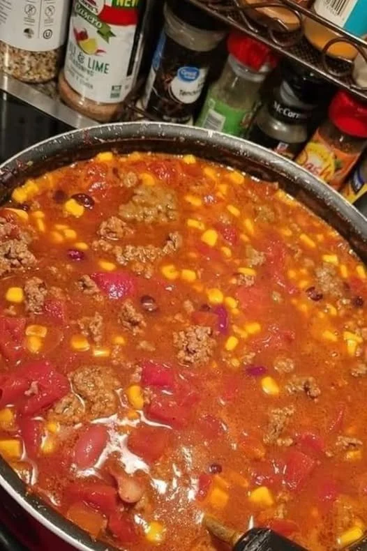 Bowl of slow cooker taco soup topped with cheese and cilantro