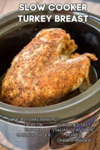 Tender slow cooker turkey breast with herbs and spices on a platter