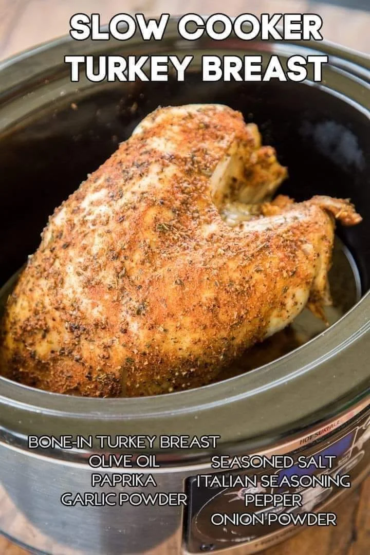 Tender slow cooker turkey breast with herbs and spices on a platter