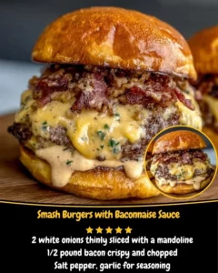 Delicious smash burgers topped with baconnaise sauce on a rustic wooden table.