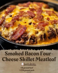 Delicious Smoked Bacon Four-Cheese Skillet Meatloaf sizzling in a skillet.