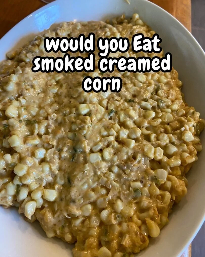 Bowl of delicious smoked corn chowder topped with fresh herbs.