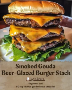 Smoked Gouda beer-glazed burger stack topped with fresh greens and condiments.