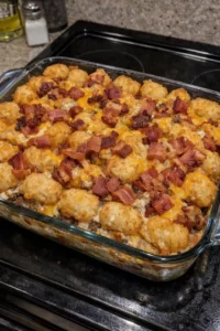 Smoky Bacon Ranch Cheeseburger Tot Bake topped with cheese and crispy bacon