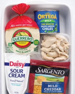 Delicious sour cream chicken enchiladas garnished with cheese and cilantro