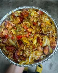 Southern fried cabbage dish served in a skillet with seasonings