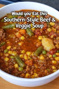 A bowl of Southern-Style Beef Veggie Soup with tender beef and colorful vegetables.