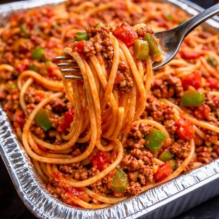 Bowl of Spaghetti with Meat Sauce topped with parmesan cheese