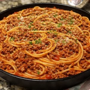 Spaghetti served with rich homemade meat sauce in a bowl