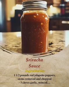 Homemade Sriracha sauce in a glass jar with fresh chili peppers
