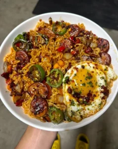 Bowl of spicy jalapeno sausage ramen topped with a fried egg