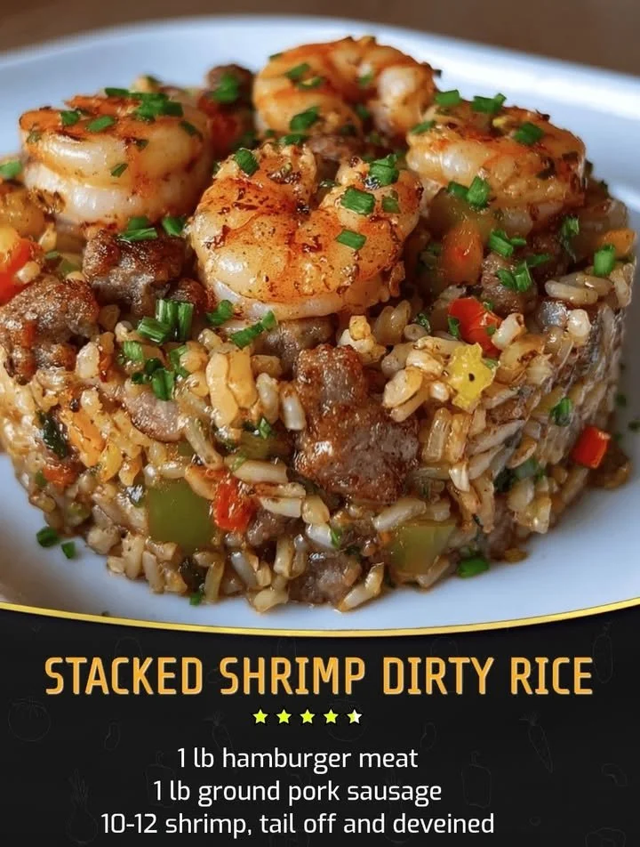 Stacked shrimp dirty rice served in a bowl with garnishes and spices