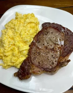 Delicious steak and eggs served on a plate for breakfast