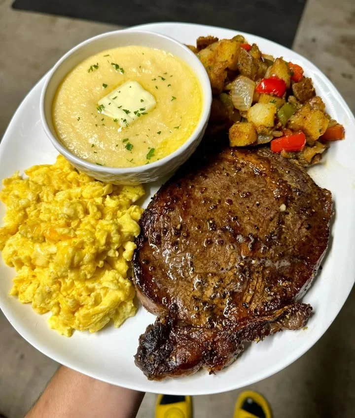 Delicious steak and eggs plate served with breakfast sides