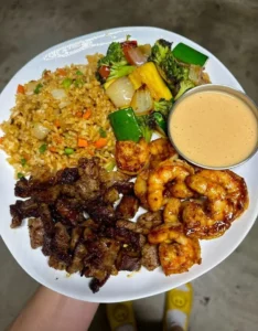 Delicious Steak and Shrimp Hibachi served on a sizzling plate