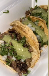 Delicious steak tacos topped with fresh ingredients and spicy salsa