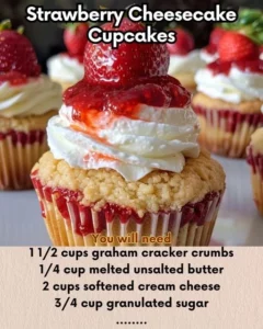 Strawberry cheesecake cupcakes topped with fresh strawberries and cream cheese frosting