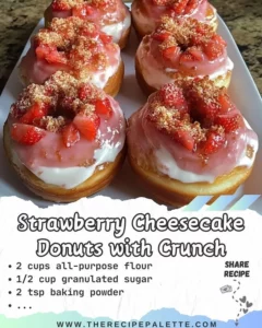 Strawberry cheesecake donuts topped with crunchy bits for added texture
