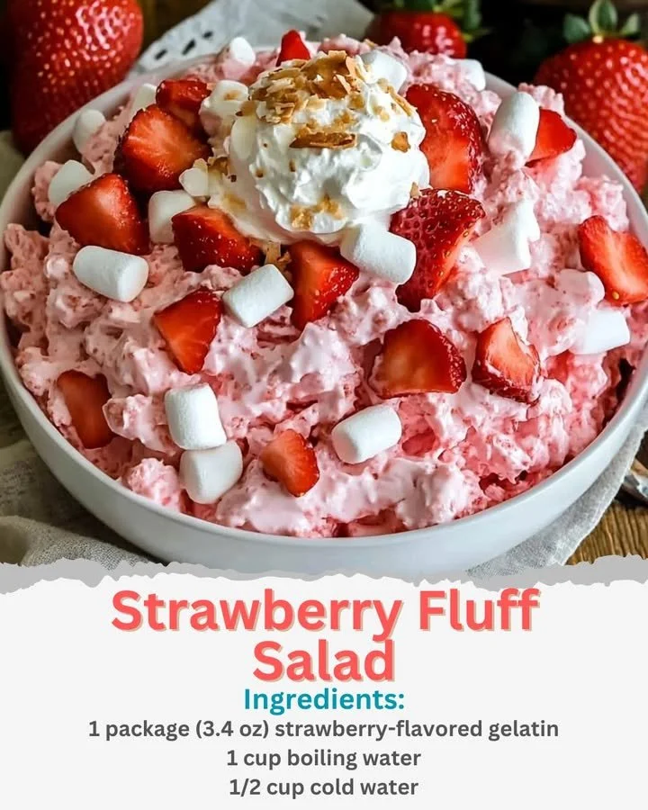 A bowl of delicious Strawberry Fluff Salad with fresh strawberries and whipped cream.