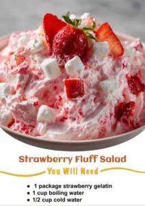 Delicious Strawberry Fluff Salad featuring fresh strawberries and creamy topping.