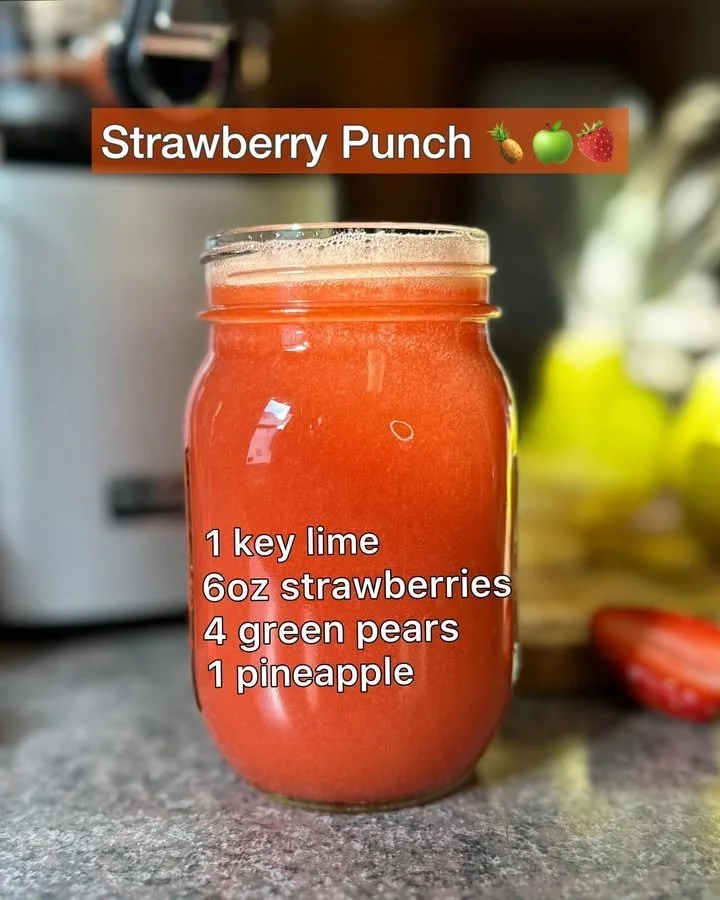 Delicious Strawberry Punch in a glass with fresh strawberries and mint leaves