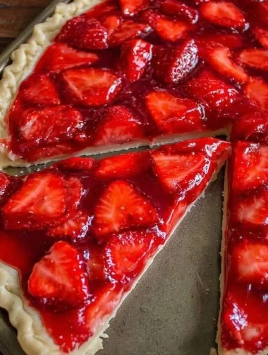 Delicious strawberry slab pie served on a rustic wooden table