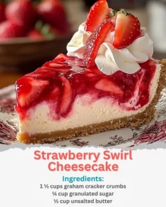 Delicious strawberry swirl cheesecake topped with fresh strawberries