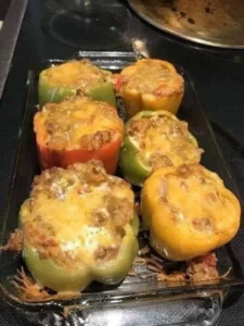 Plate of colorful stuffed bell peppers with a variety of fillings