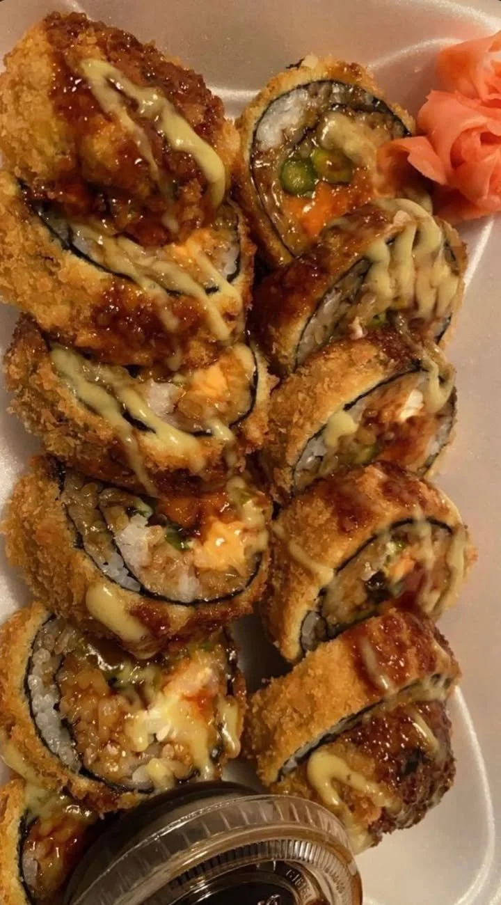 A beautifully arranged platter of various sushi types including nigiri and maki.