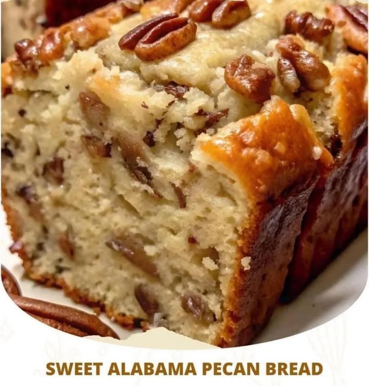 Loaf of Sweet Alabama Pecan Bread fresh out of the oven with nuts on top