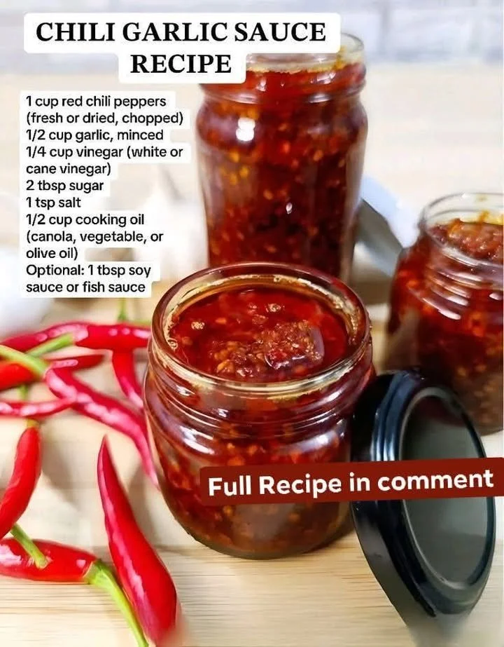 Homemade sweet chili garlic sauce in a glass jar with fresh ingredients