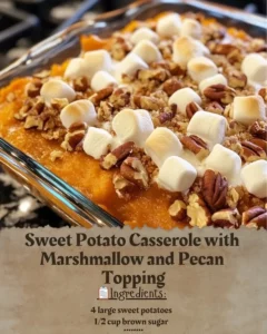 Sweet potato casserole topped with marshmallows and pecans, served in a bowl.