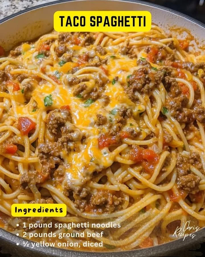 A plate of Taco Spaghetti topped with cheese and cilantro, showcasing a delicious fusion dish.
