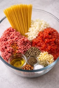 Delicious bowl of Taco Spaghetti topped with cheese and cilantro