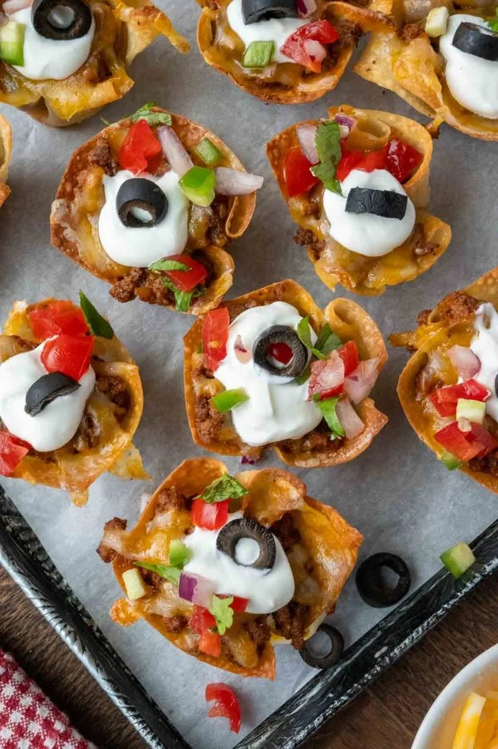 Delicious Taco Wonton Cups filled with seasoned beef and toppings.