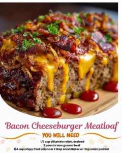 Delicious bacon cheeseburger meatloaf served on a plate with toppings.