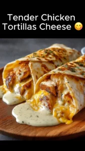 Tender chicken wrapped in tortillas with creamy cheese sauce