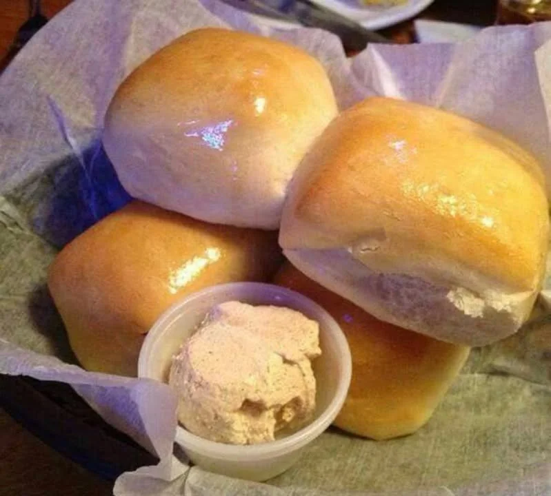 Freshly baked Texas Roadhouse Rolls served with cinnamon butter