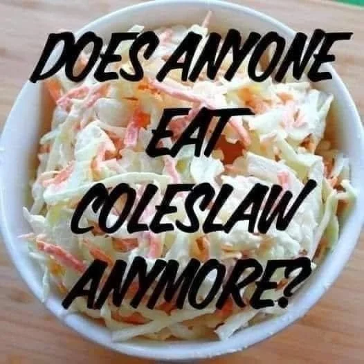 Bowl of KFC coleslaw with fresh vegetables and creamy dressing
