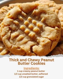 Thick and chewy peanut butter cookies on a baking sheet