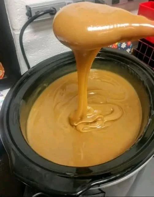 Thick caramel sauce drizzled over dessert, showcasing its smooth and rich texture.