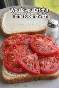 Delicious tomato sandwich made with fresh tomatoes and whole grain bread.