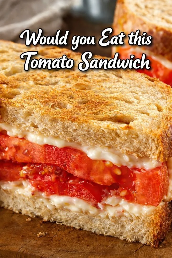 Delicious tomato sandwich made with fresh tomatoes and herbs on toasted bread