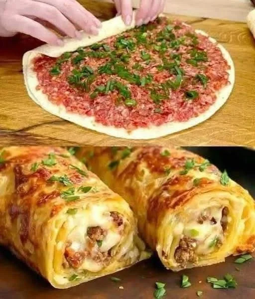 Tortilla wraps filled with ground beef, lettuce, and tomatoes on a plate